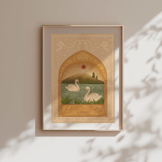 Video of framed fine art print of two white swans on a teal sparkly lake under a red moon and a golden arch. Angel wings and stars above and grape vines and an eye below.